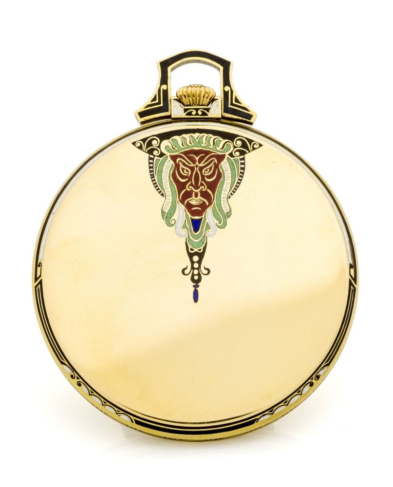 DOXA, ''THE MASK'', NEW OLD STOCK Very fine and rare Art Deco open face dress watch.14K yellow gold and enamel keyless watch with a beautiful Chinese mask decoration on the back.