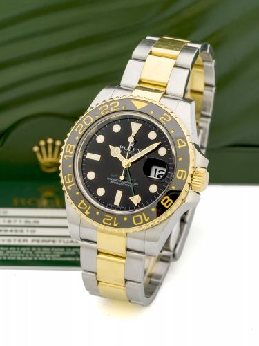 ROLEX, GMT MASTER II, REF. 116713 A fine, self-winding, stainless steel and gold wristwatch with two time-zones.