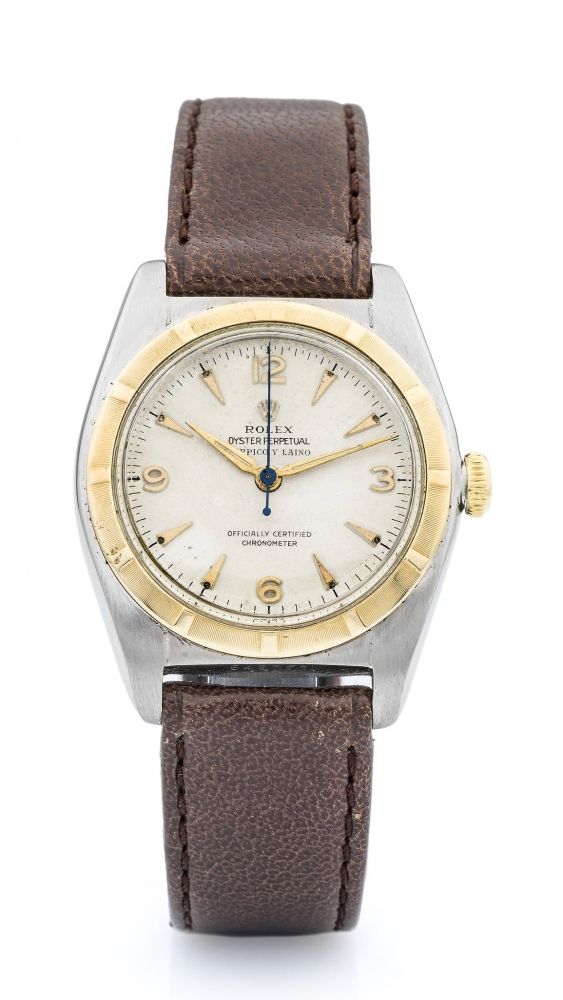 ROLEX, REF. 5010, RETAILED BY SERPICO Y LAINO A fine, self-winding stainless steel and gold wristwatch.