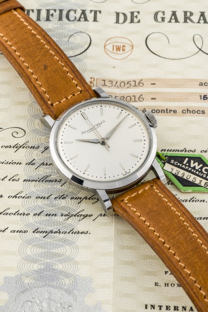 IWC, CENTER-SECONDS, STEEL, NEW OLD STOCK, ORIGINAL CERTIFICATE AND HANG TAG A fine, very rare, new old stock, manual wind, stainless steel wristwatch.