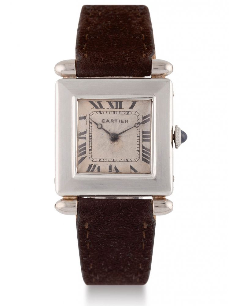 CARTIER TANK OBUS, PLATINUM Very fine and rare platinum Cartier "Tank obus " with silver "rayon de soleil" dial. Très belle et rare montre Bracelet 'Tank Obus' en platine. Cadran rayon de soleil. Mouvement mécanique pour European Watch & Clock Co.