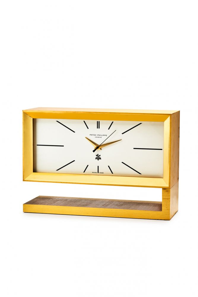 PATEK PHILIPPE REF. 1160 E, QUARTZ TABLE CLOCK WITH CENTRE-SECONDS. “SBS”. GILDED BRASS