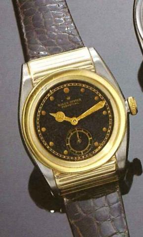 Rolex Oyster Perpetual Rigid Hooded.Ref. 3134, 1940 's..Very fine tonneau shaped, self winding, yellow gold.and stainless steel gentleman's wristwatch.