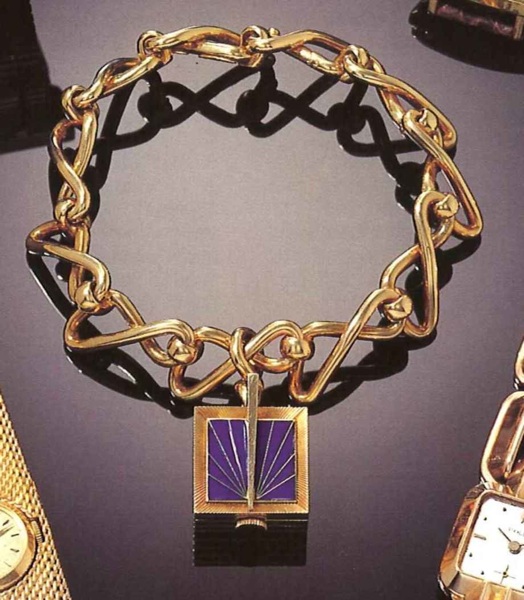 Rolex, Ref. 9511, 1940's..Very fine square, 18ct gold and cloisonn_ enamel.Iady's wristwatch, in the shape of a sundial, with.fancy linked bracelet.