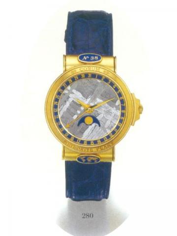 Corum, Meteorite Peary, No. 38.Ref. 71.450.56. Produced.in the 1990's..Very fine and rare, self-winding, water-resistant, 18K yellow gold gentleman's wristwatch with date and moon phases. Accompanied by certificate.