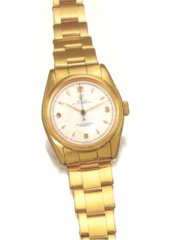 Rolex Oyster Perpetual Officially Certified Chronometer, Ref. 6048. Produced in the1950's..Very fine tonneau-shaped, center-seconds, self-winding, water-resistant, 18K pink gold gentleman's wristwatch with an 18K pink gold Oyster bracelet.