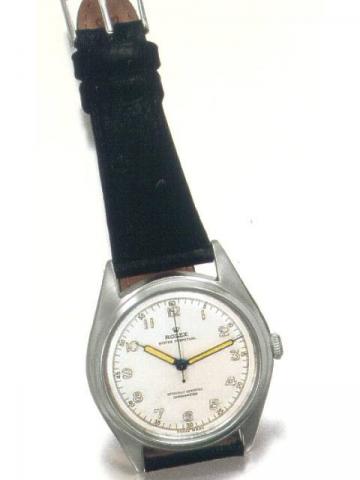 Rolex Oyster Perpetual Officially Certified Chronometer, Ref. 5028. Produced in the 1960's..Fine center-seconds, self-winding, water-resistant, tonneau-shaped, stainless steel gentleman's wristwatch with a stainless steel Rolex buckle.