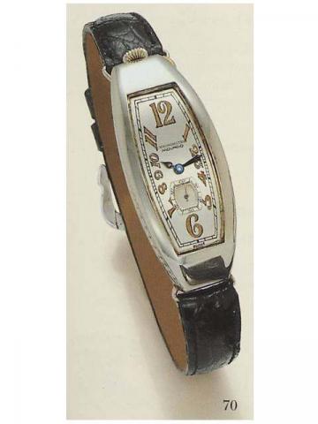 Movado, Polyplan Chronometer, Ref. G 4003. Production of this reference started in 1912.Fine and rare, tonneau-shaped, curved, 18K white gold lady's wristwatch.