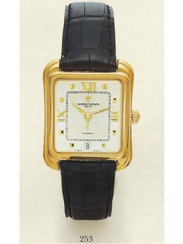Vacheron Constantin, Les Essentielles Ref. 42100. Produced in the 1990's.Very fine, rectangular curved, self-winding, 18K yellow gold gentleman's wristwatch with a date and an 18K yellow gold buckle. Accompanied by a leather pouch and a certificate.