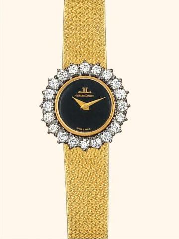 Jaeger LeCoultre, Duo-Plan, Ref. 7680/21. Produ-ced in the 1950's.Fine, 18K yellow and white gold, dia-mond-set lady's wristwatch with linen textured 18K yellow gold bracelet.