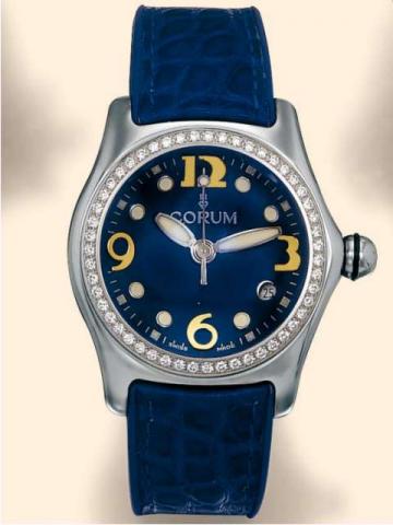 Corum, Bubble _ Boutique, Ref. 39.151.47. Produced in 2001..Fine and unusual, curved, water-resistant, stainless steel and diamonds, unisex mid-sized quartz wristwatch with date, a thick domed crystal creating a lens effect, blue leather strap and a stain