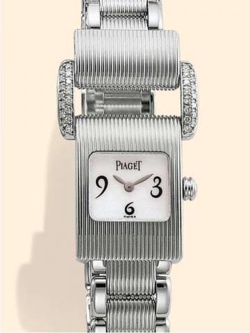 Piaget, Geneve, Miss Protocole, Ref. 5222. Produced in 2001..Fine and unusual, asymmetrical, 18K white gold and diamonds lady's quartz wristwatch with an articulated Piaget bracelet with ribbed links at the center, polished on the sides and an unusual 18K