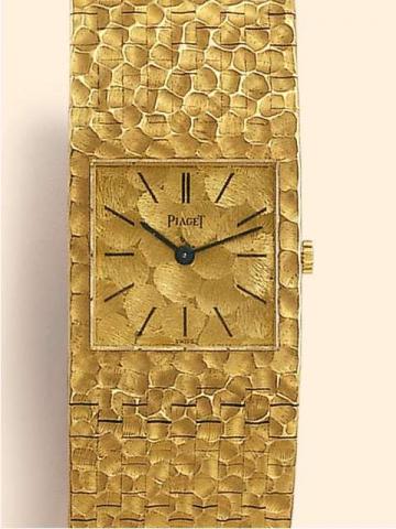 Piaget, Ref. 9352. Produced in the 1960's..Very fine, square, 18K yellow gold gentleman's wristwatch with integrated, textured 18K yellow gold bracelet.