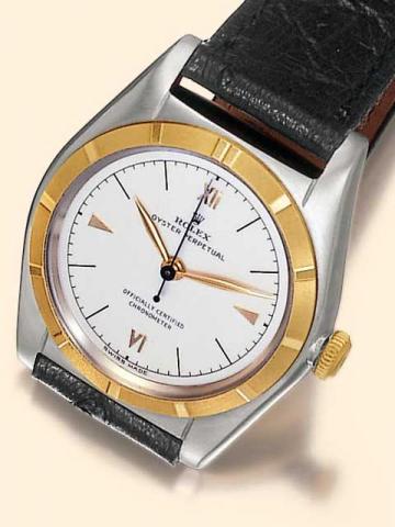 Rolex Oyster Perpetual Officially Certified Chronometer, Ref. 4919. Produced in the 1950's.Fine and rare, tonneau-shaped, center-seconds, self-winding, water-resistant, stainless steel and yellow gold gentleman's wristwatch.