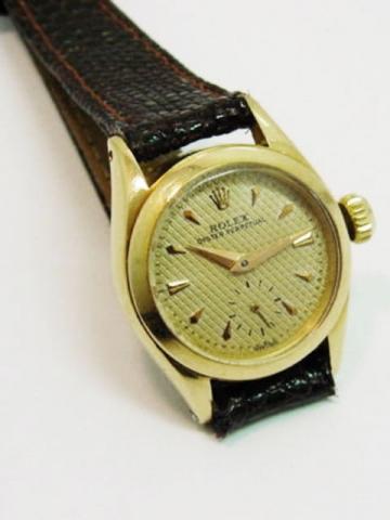 Rolex Oyster Perpetual, Ref. 6504. Produced in the 1950's. Fine and rare, self-winding, water-resistant, 18K pink gold lady's wristwatch with a Rolex buckle.