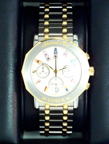 Corum Admiral's Cup, Ref. 96.830.21 V 585. Produced in the 1990's, sold on January 15, 2003..Very fine, water-resistant, dodecagonal 18K yellow gold and stainless steel gentleman's quartz wristwatch with date, round button chronograph and registers, and a