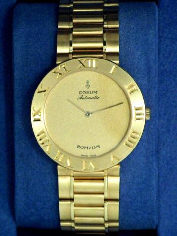Corum Romulus, Ref. 58.903.56 V 400. Produced in the 1990's, sold on January 15, 2003..Fine, self-winding, water-resistant, 18K yellow gold gentleman's wristwatch with 18K brushed gold Corum link bracelet. Accompanied by a fitted box and certificate.