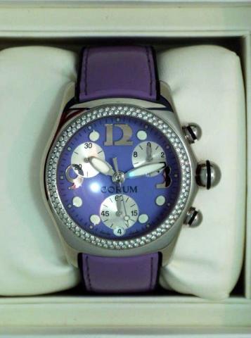 Corum Boutique, Bubble Chronograph, Ref. 396.152.47. Produced in the 1990's, sold on January 15, 2003..Fine and atypical, curved, water-resistant, stainless steel and diamond, unisex quartz wristwatch with round button chronograph, registers and date, a t