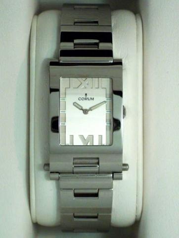 Corum, Tabogan, Ref. 64.151.20. Produced in the 1990's, sold on January 15, 2003..Fine and unusual, water-resistant, asymmetrical, rectangular curved, stainless steel quartz gentleman's wristwatch bearing a sliding and hinged mechanism which transforms th