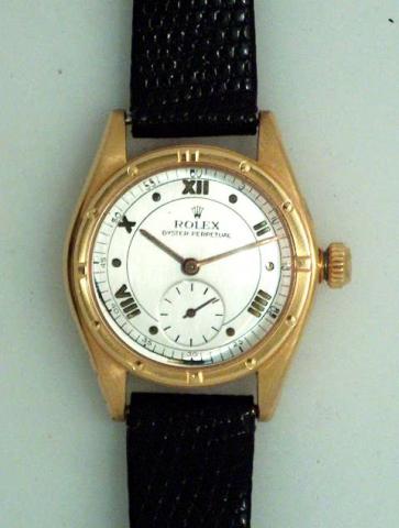Rolex Oyster Perpetual, Ref. 3795. Produced in the 1930's..Fine and rare, tonneau-shaped, self-winding, 18K pink gold mid-sized wristwatch.
