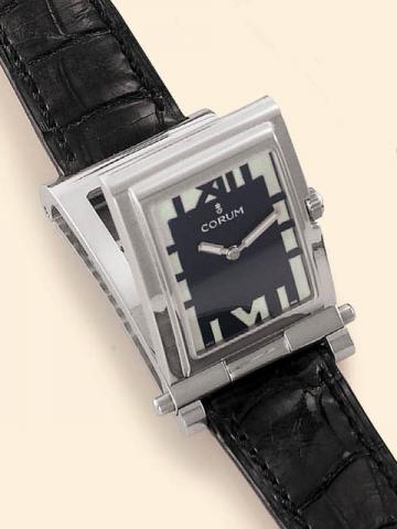Corum Tabogan, Ref. 64.151.20. Produced in the 1990's, sold on January 15, 2003.Fine and unusual, water-resistant, asymmetric, rectangular curved, stainless steel quartz gentleman's wristwatch bearing a sliding and hinged mechanism which transforms the wa