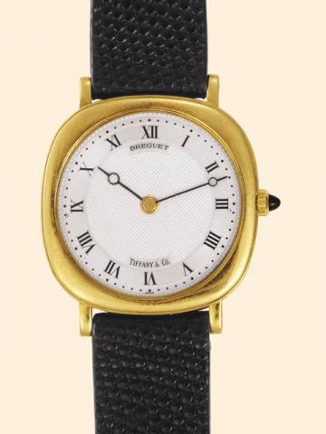Breguet, Ref. 3560. Retailed by Tiffany & Co. Produced in the 1980's.Very fine and elegant, cushion shaped, thin, 18K yellow gold gentleman's wristwatch with an 18K yellow gold Breguet buckle.