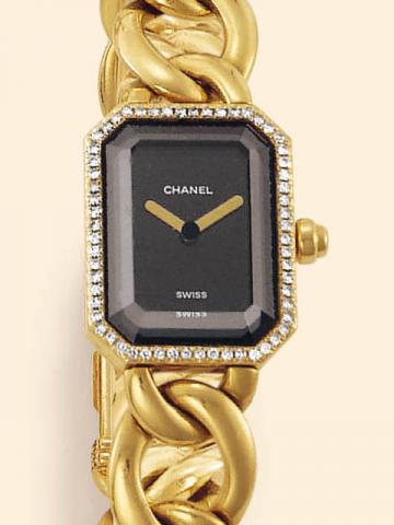 Chanel Paris.Produced in the 1990's.Fine and elegant, rectangular, 18K yellow gold and diamonds lady's wristwatch with an integrated 18K yellow gold Chanel bracelet and diamond-set clasp.