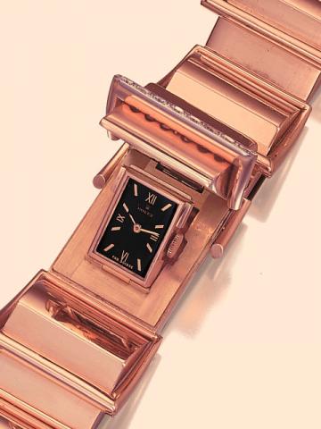 Rolex Precision, Ref. 4153. Produced in the 1940s. Very fine, asymmetric, 18K pink gold and diamond lady's wristwatch with concealed dial and wide 18K pink gold bracelet made up of 6 asymmetric triangular elements each decorated with an overhanging rectan