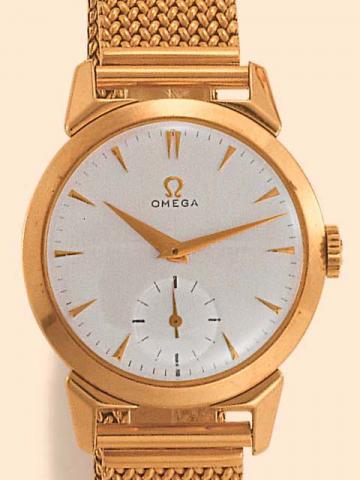 Omega, Ref. 2712-1. Produced in the 1960's.Fine, yellow gold-filled gentleman's wristwatch with an 18K yellow gold mesh bracelet.
