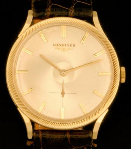 Longines. Produced in the 1950's.Fine, 14K yellow gold gentleman's wristwatch.