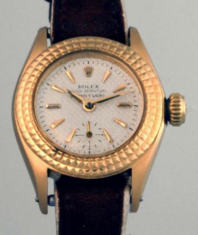 Rolex, retailed by Serpico Y Laino, Oyster Perpetual, Ref. 6515. Produced inthe 1950's.Fine and rare, self-winding, water-resistant, 18K yellow gold lady'swristwatch with a Rolex buckle.