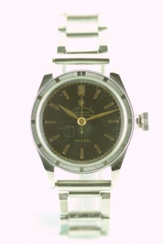 Rolex Oyster Imperial Chronometre, Ref. 2595, retailed by Beyer Zurich. Produced circa 1938.Very fine, tonneau-shaped, mid-size, center-seconds, water-resistant, stainless steel boy's wristwatch with a stainless steel link bracelet.