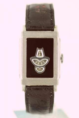 Rolex, Ref. 1775. Produced in the 1930's.Very fine and very rare rectangular, nickel chromium and black enamel gentleman's wristwatch with digital jump-hour, minutes and seconds.