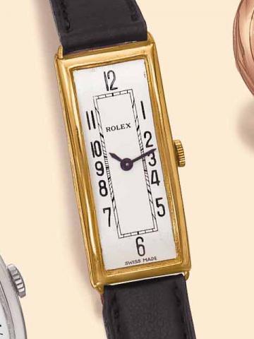Rolex, Ref. 5114, London import marks for 1926. Very fine and rare, rectangular curved, narrow, 18K yellow gold gentleman