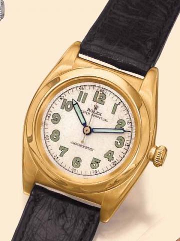 Rolex, Oyster Perpetual Chronometer, Ref. 3131. Manufactured in the 1940s. Fine, tonneau-shaped, center-seconds, self-winding, water-resistant, 14K yellow gold wristwatch.
