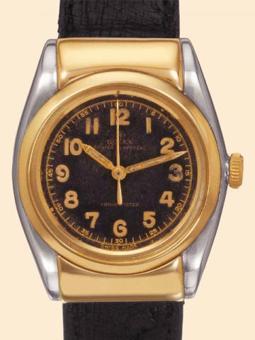 Rolex Oyster Perpetual Chronometer, Rigid Hooded, Ref. 3065. Manufactured in the early 1940s. Very fine and rare, tonneau-shaped, center-seconds, self-winding, water-resistant, stainless steel and yellow gold gentleman