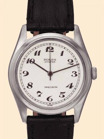 Rolex Oyster Precision, Ref. 4377/ 4461. Manufactured in the 1940s. Very fine and rare, tonneau-shaped, center-seconds, water-resistant, stain-less steel gentleman