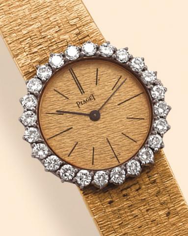Piaget, Ref. 9171A6. Produced in the 1970s. Fine, 18K yellow gold and diamond lady's wristwatch with an integrated, 18K yellow gold bark-finished Piaget bracelet.