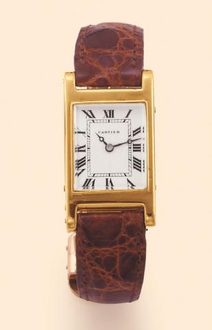 Cartier Paris,Tank, case No. 164562. Produced in the 1940s. Fine, rectangular, 18K yellow gold lady's wristwatch with an 18K pink gold deployant clasp.