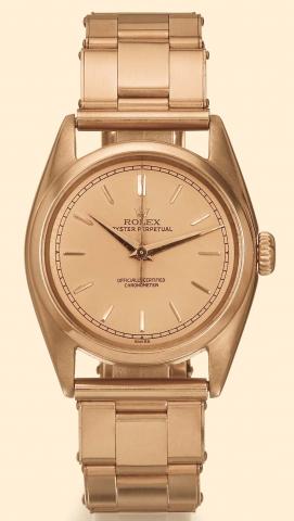 Rolex Oyster Perpetual, Chronometer Officially Certified, Ref. 5009. Produced in the 1950s. Fine center-seconds, self-winding, water-resistant, pink gold and steel gentleman's wristwatch with a pink gold Oyster bracelet.