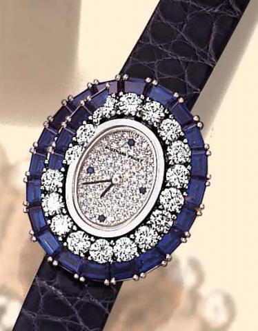 Audemars Piguet, Geneve, No. 1, Ref. 41391. Manufactured in the 1990s. Very fine, oval, 18K white gold, diamond and sapphire lady's quartz wristwatch with a blue leather strap and an 18K white gold Audemars Piguet buckle.