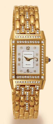 Jaeger-LeCoultre, Reverso Joaillerie, No. 267.1.86. Produced in the 1990s. Fine and unusual, rectangular, 18K yellow gold and diamonds lady's reversible wristwatch with an 18K yellow gold Jaeger-LeCoultre bracelet 