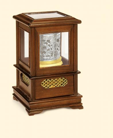 Japan, circa 1820. Very fine and very rare ivory, silver, and mulberry wood hour-striking table clock with horizontal dial.