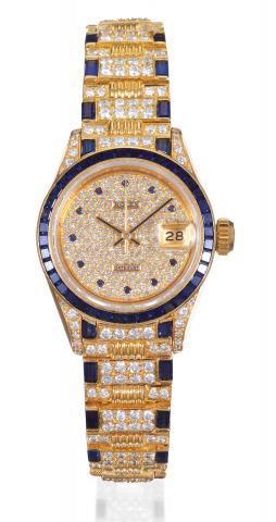 Rolex, Oyster Perpetual Datejust, Superlative Chronometer Officially Certified, Ref. 69028. Made in.the 1980s..Fine, center-seconds, self-winding, water-resistant, 18K yellow gold diamond and sapphire lady's.wristwatch with date and an 18K yellow gold, di