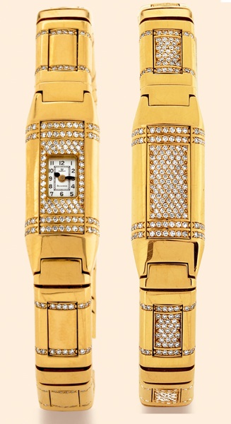 Night and Day.Jaeger-LeCoultre, Reverso Joaillerie.No. 4, Ref. 280.2.70. Made in a limited.number, circa 2000..Very fine, rare and unusual, rectangular, 18K yellow gold and.diamond lady's reversible bracelet watch with an 18K yellow.gold integrated Jaeger