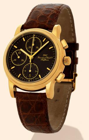 International Watch Co., Schaffhausen.Chronograph, Ref. 3703. Made in the.1990s..Fine, 18K yellow gold gentleman's wristwatch with date.square button chronograph, registers and an 18K yellow gold.IWC buckle. Accompanied by a fitted box and certificate.