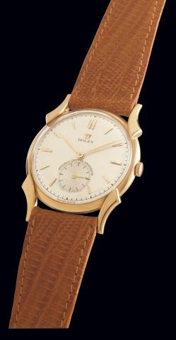 Ref. 4477.Oriental Lugs.Rolex, Officially Certified.Chronometer, Ref. 4477. Case.No. Illegible. Made in 1945/46..Fine and rare, 18K yellow gold gentleman's.wristwatch with gold plated Rolex.buckle.