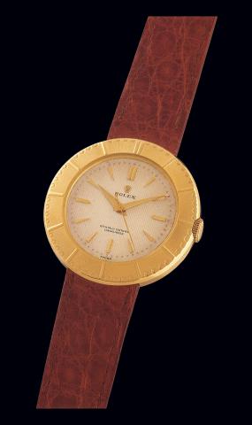 Ref. 8724 Yellow.Gold Champs-.Elysees.Rolex Officially Certified Chronometer.Ref. 8724. Case No. 933322..Made in 1953..Very fine and elegant center seconds, 18K.yellow gold gentleman's wristwatch with.a gold-plated Rolex buckle.