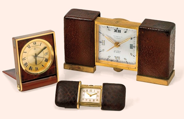 A lot of three timepieces.A. Jaeger-LeCoultre, No. 2302486, Ref. 11167.71..Made in the 1960s..Fine and unusual, rectangular, gold-plated and simulated.tortoise shell desk alarm-clock with date.