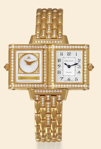 Duo-Dial, Day and Evening.Jaeger-LeCoultre, Reverso Joaillerie.No. 266.1.44, case No. 1980559. Made circa 2000..Fine elegant, rectangular, double-dial, 18K yellow gold and.diamond lady's reversible wristwatch with an 18K gold and.diamond-set Jaeger LeCoul